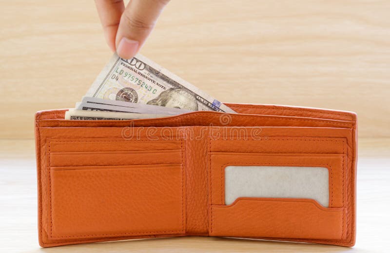 Hand Stealing Out Money from Wallet on Wooden Table. Stock Photo Image of debt, financial