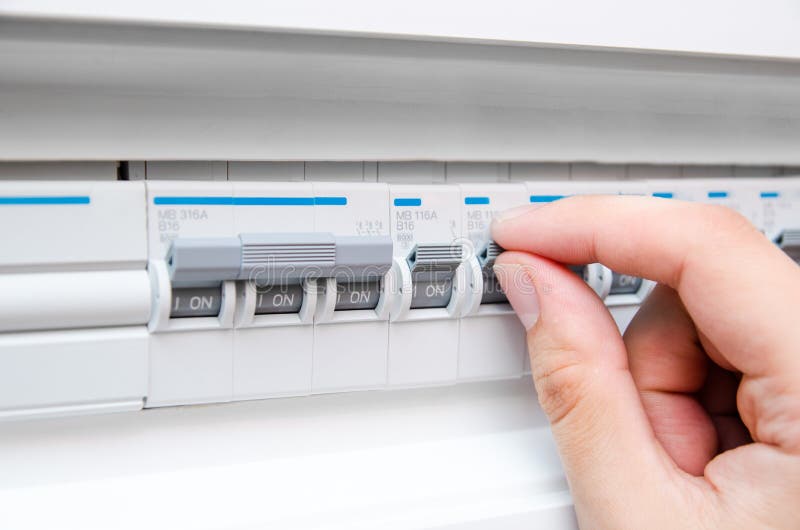 Man Turning on the Fuse Box Stock Photo Image of system, electric
