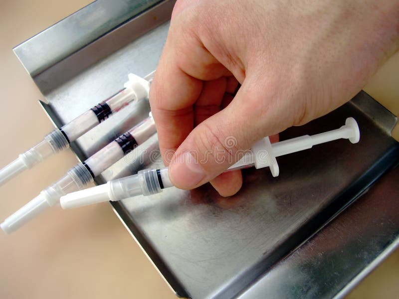 Hand with syringes... stock images Hand with syringes... stock images