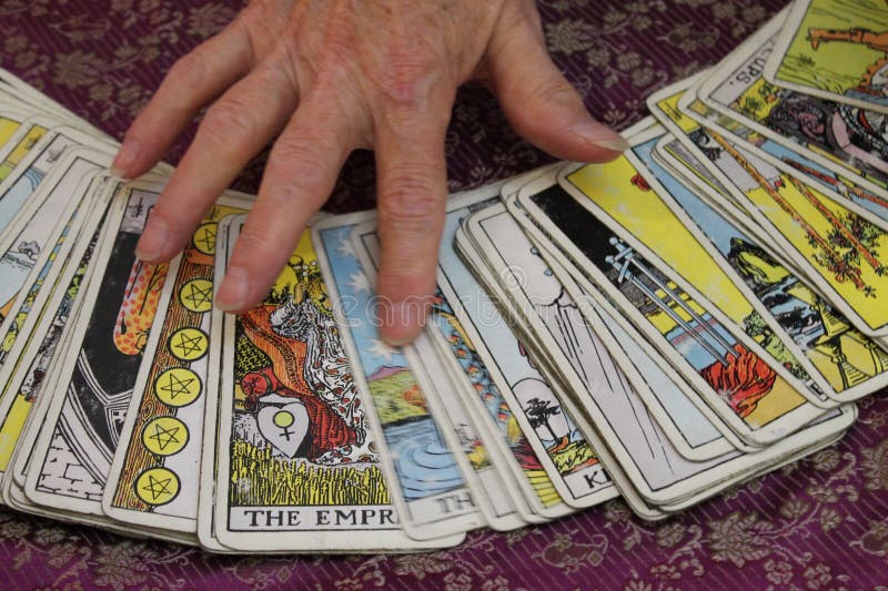 Hand on Tarot Cards