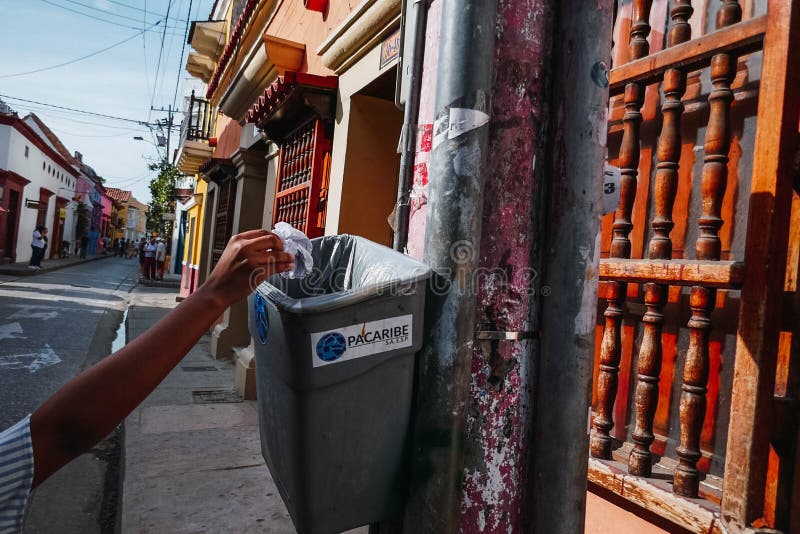 Man`s Hand Throwing Paper in the Recycle Bin, Environmental Protection