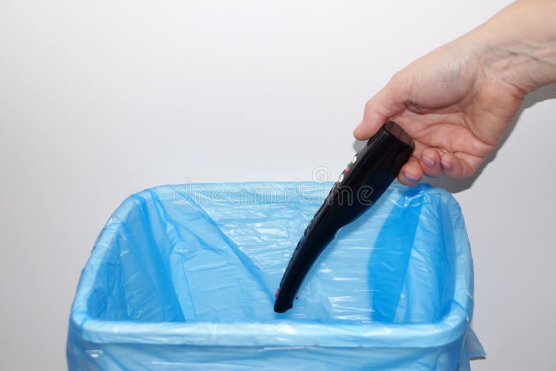 Hand Throwing Tv Remote into Trash Can Stock Image Image of reusing