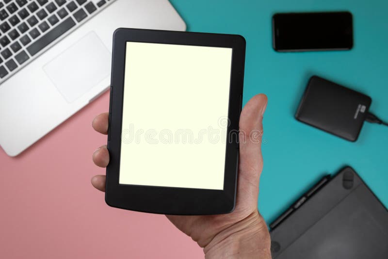 Hand touch on empty screen of tablet above colorful table top view, Leave space for display of your content, Technology concept, m stock image Hand touch on empty screen of tablet above colorful table top view, Leave space for display of your content, Technology concept, m stock image