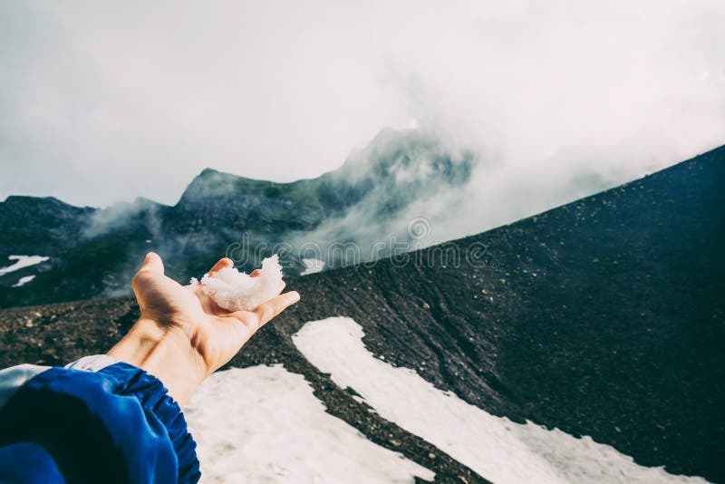 Hand touching snow through the clouds fog sochi Mountains landscape emotional Travel Lifestyle wanderlust concept adventure summer royalty free stock photos Hand touching snow through the clouds fog sochi Mountains landscape emotional Travel Lifestyle wanderlust concept adventure summer royalty free stock photos