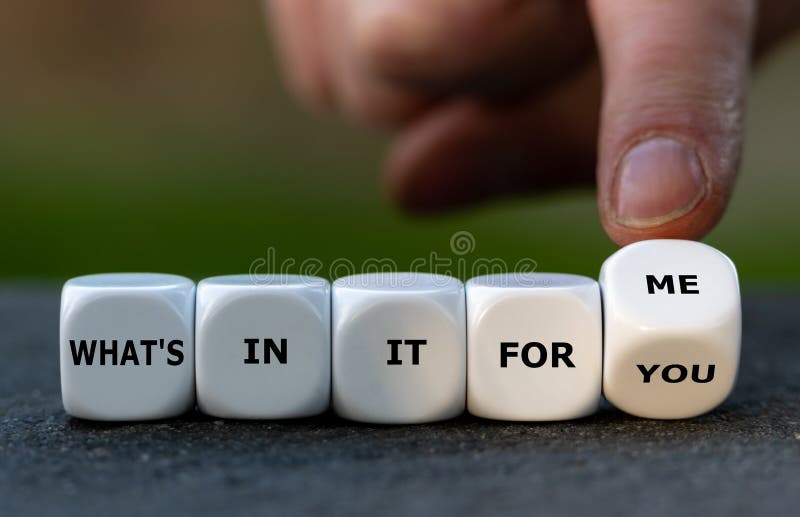 Hand turns dice and changes the expression `what`s in it for you` to `what`s in it for me`.