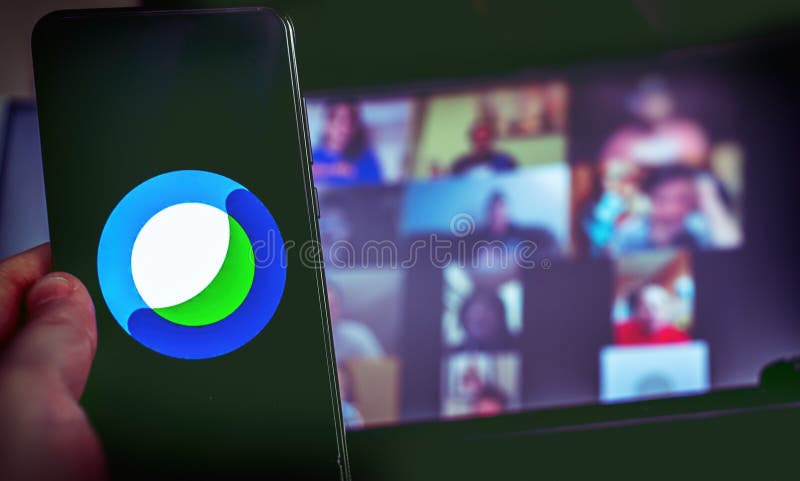 Hand use videoconference app icon of Cisco Webex on smartphone