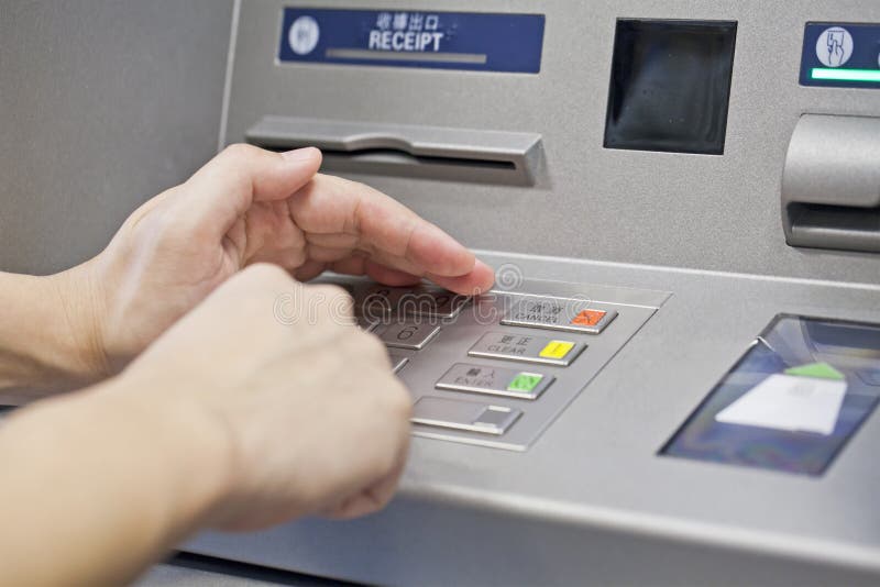 Hand using atm machine royalty free stock images
