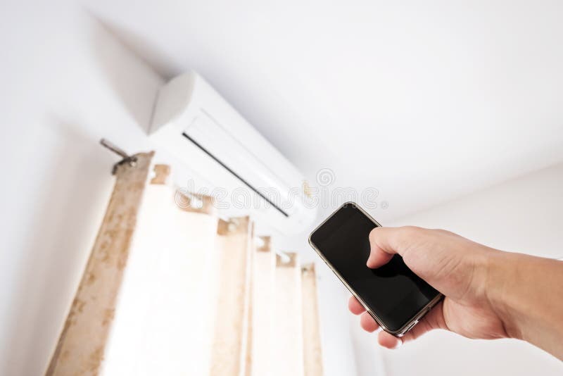 Hand Using Smartphone Controlling Air Conditioning Stock Photo Image