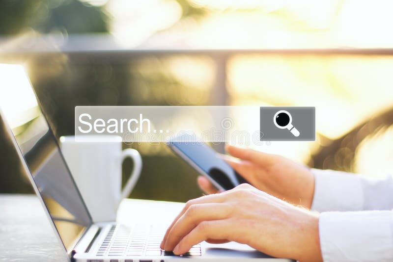 Hand using smartphone laptop with internet browser search bar stock photo