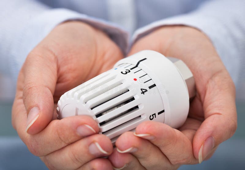 Hand With Valve Of Heating System stock image
