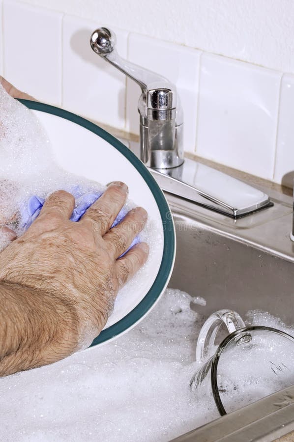 Hand washing the dishes stock photo. Image of bubbles 12765776