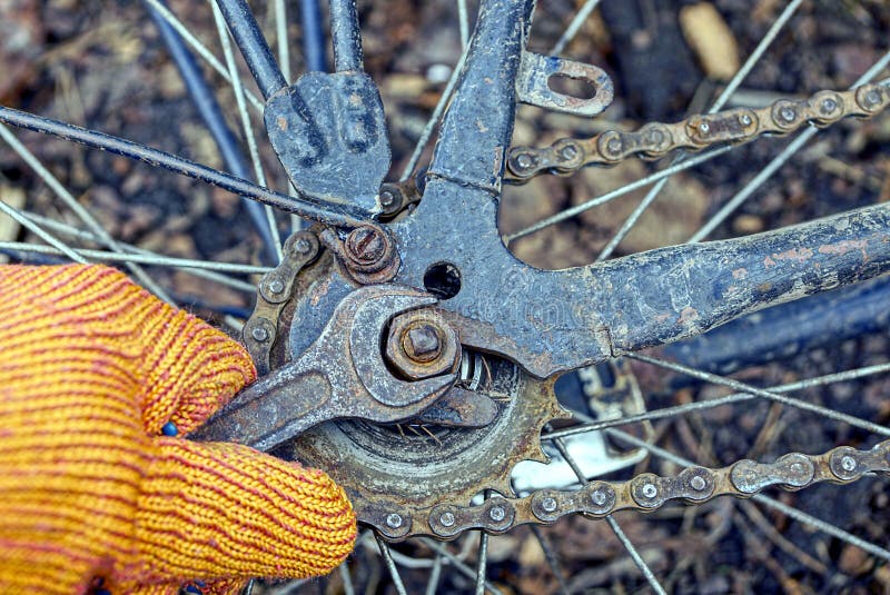 Hand with a Wrench and a Nut on a Bicycle Wheel Stock Image Image of