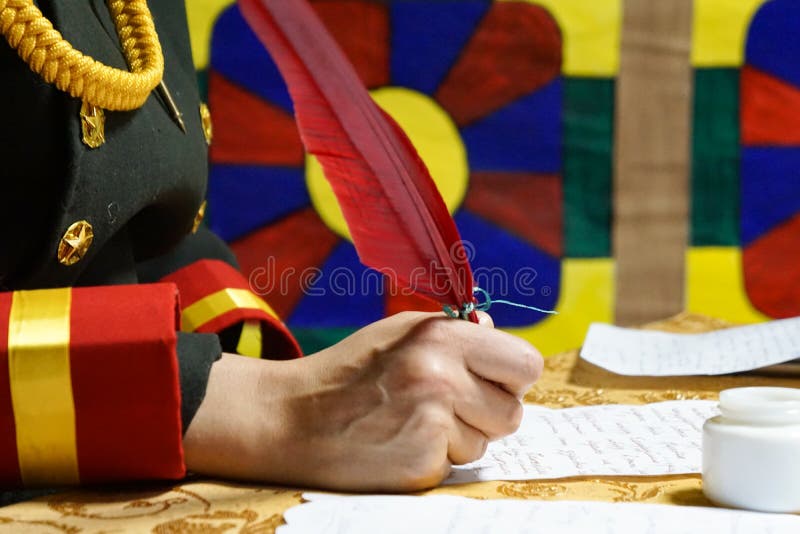Hand writes red quill pen on parchment royalty free stock images Hand writes red quill pen on parchment royalty free stock images