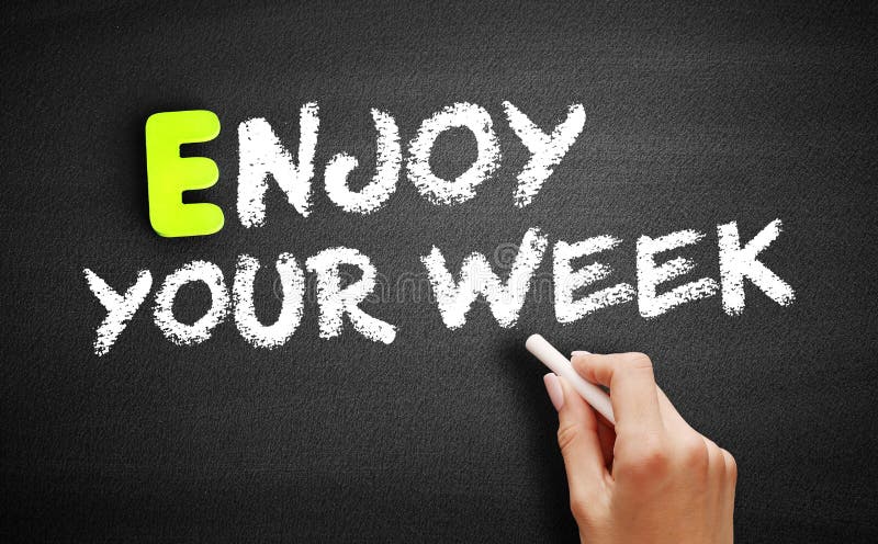 Hand writing Enjoy Your Week on blackboard, concept background stock images