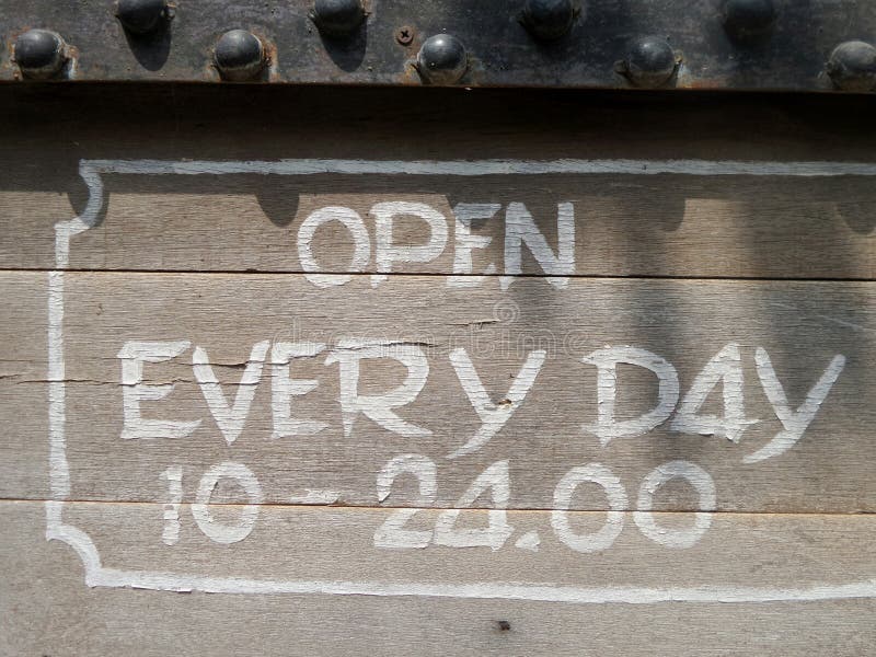 Hand writing opening hours stock photo. Image of chalk 79307498