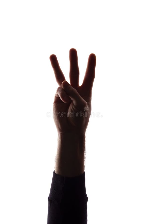 The hand of a young man with his fingers apart, number the three - silhouette, concept abstraction. The hand of a young man with his fingers apart, number the three - silhouette, concept abstraction