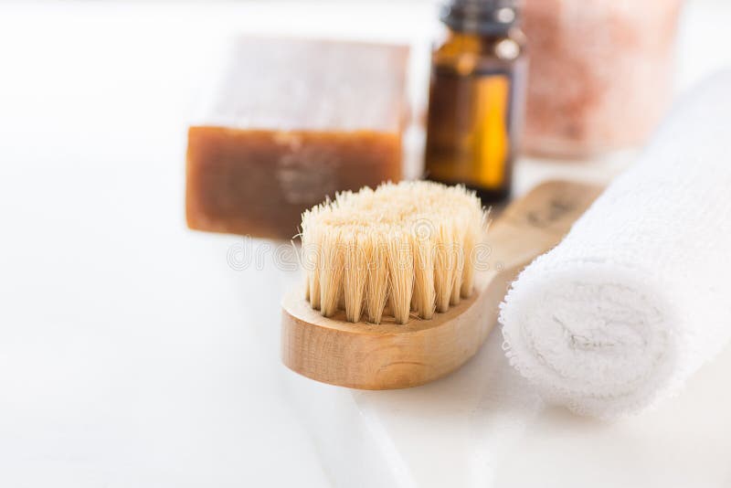Handmade Coal Tar Soap Brush Pink Himalayan Salt Essential Oil Towel on White Marble Background. Spa Wellness Relaxation Body Care stock photography Handmade Coal Tar Soap Brush Pink Himalayan Salt Essential Oil Towel on White Marble Background. Spa Wellness Relaxation Body Care stock photography