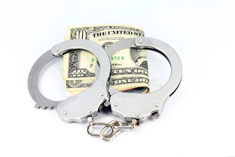 Handcuffs and American money isolated on white. Handcuffs and American money isolated on white