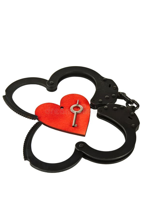 Handcuffs in Heart Shape and Key within Isolated Stock Photo Image of