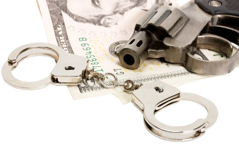 Handcuffs van het pistool geld stock afbeelding Handcuffs van het pistool geld stock afbeelding