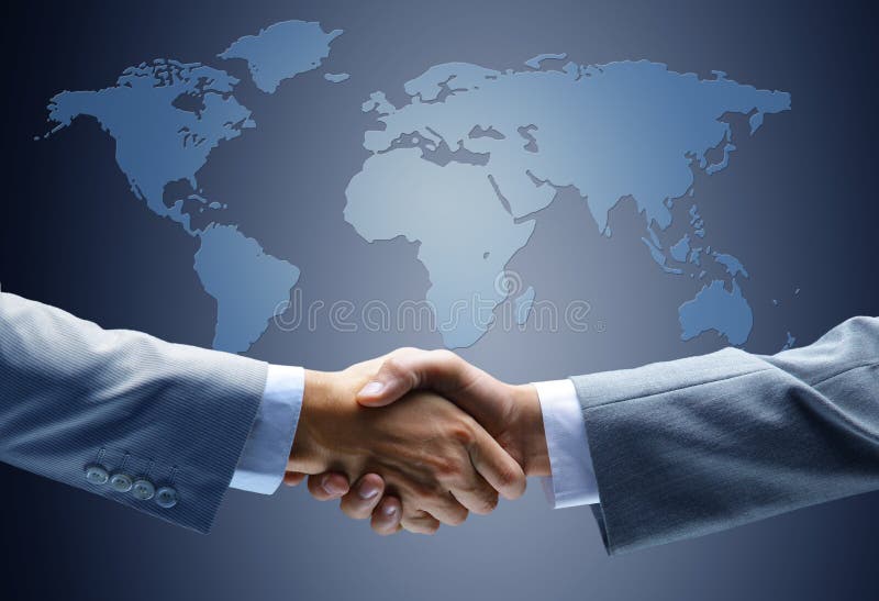 Handdruk met kaart van de wereld stock afbeelding Handdruk met kaart van de wereld stock afbeelding
