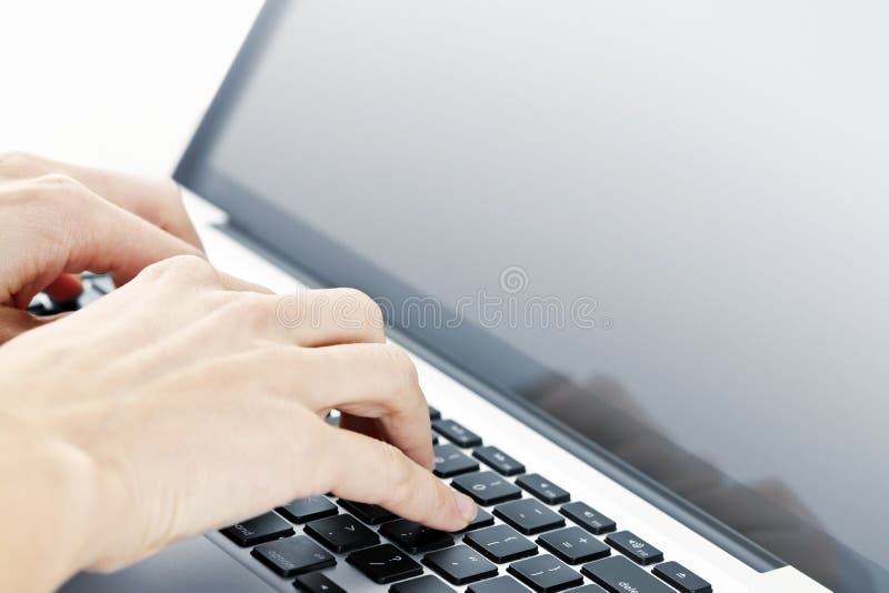 Hands typing on laptop computer keyboard close up. Hands typing on laptop computer keyboard close up