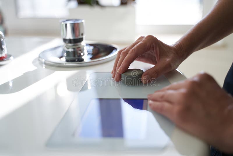 Close up of a modern convenient bathtub for hydrotherapy. Hand of beautician adjusting the settings for the client. Close up of a modern convenient bathtub for hydrotherapy. Hand of beautician adjusting the settings for the client