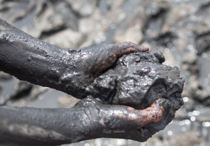 Handful of black healing mud