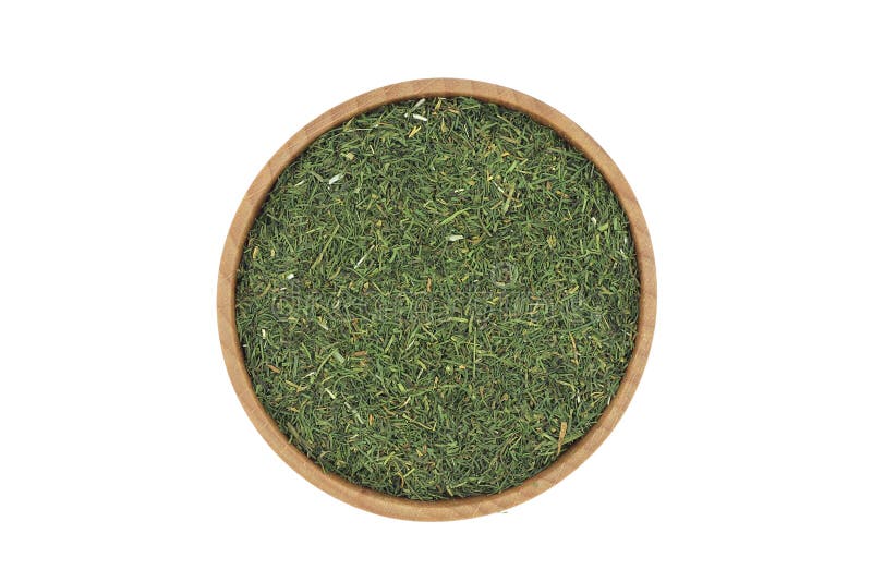 A handful of dried dill in a wooden bowl royalty free stock image