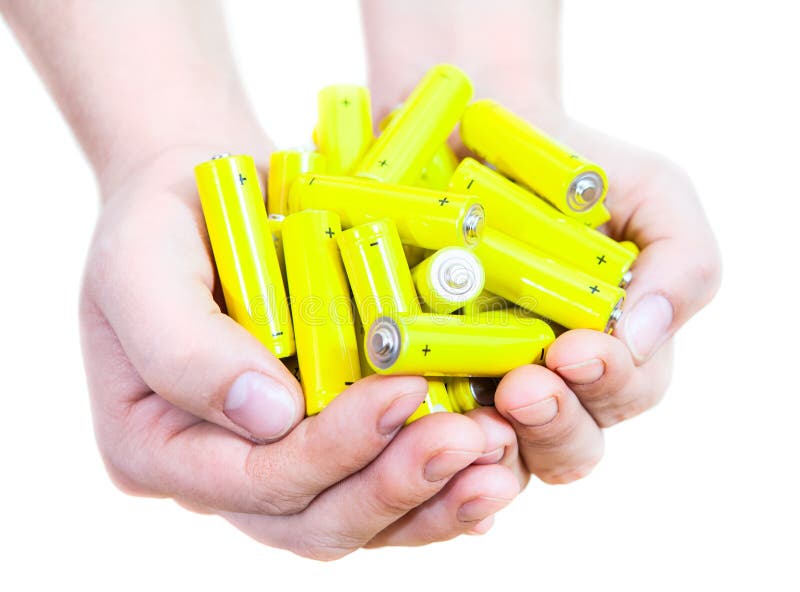 Handful with lot yellow penlight batteries isolated on white background royalty free stock photo Handful with lot yellow penlight batteries isolated on white background royalty free stock photo