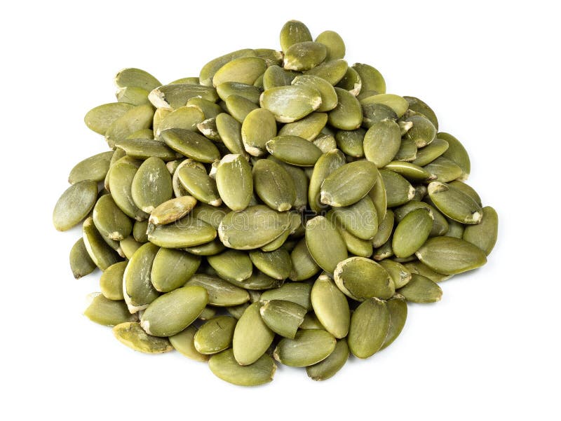 Handful of peeled pumpkin seeds closeup on white background