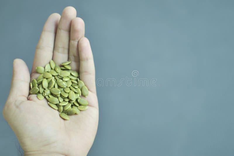 Handful of Pumpkin seeds stock image. Image of pepitas 167362601