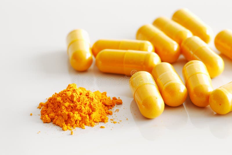A Handful of Turmeric Capsules with the Contents of One Spilled Stock Photo Image of medicine