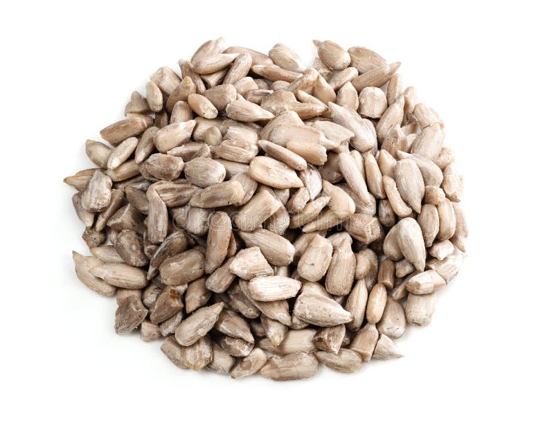 Handful of unpeeled sunflower seeds closeup on white background. Handful of unpeeled sunflower seeds closeup on white background