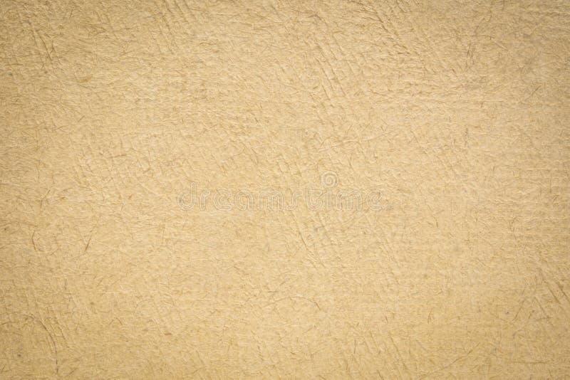 Brown handmade textured paper crafted in Mexico, background with vignette. Brown handmade textured paper crafted in Mexico, background with vignette