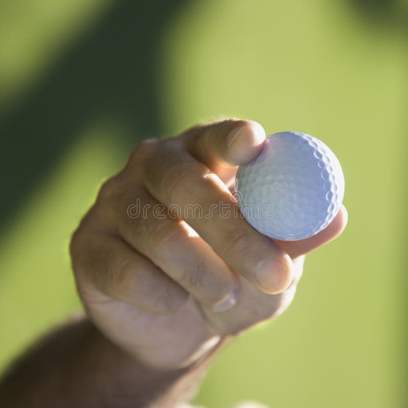 Handholding-Golfball. lizenzfreie stockfotos Handholding-Golfball. lizenzfreie stockfotos
