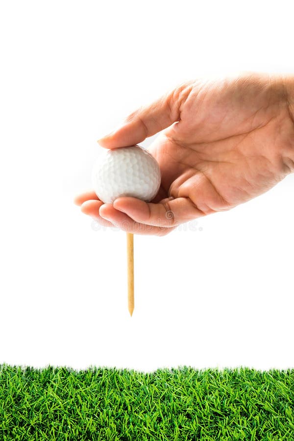 Handhållgolfboll med utslagsplatsen på kurs royaltyfri fotografi Handhållgolfboll med utslagsplatsen på kurs royaltyfri fotografi