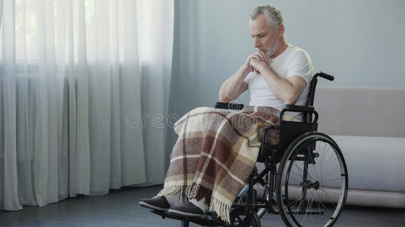 Handicapped person sitting in wheelchair and thinking about life, depression, stock footage