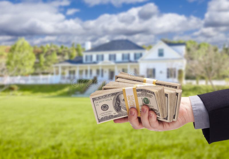 Handing Over Cash For House in Front of Home stock photos Handing Over Cash For House in Front of Home stock photos