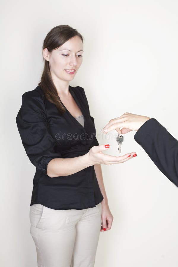 Real Estate Agent handing over keys. Real Estate Agent handing over keys