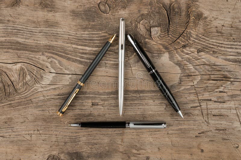 Handles lie on the table in the form of a triangle, with a place for your text. stock images Handles lie on the table in the form of a triangle, with a place for your text. stock images