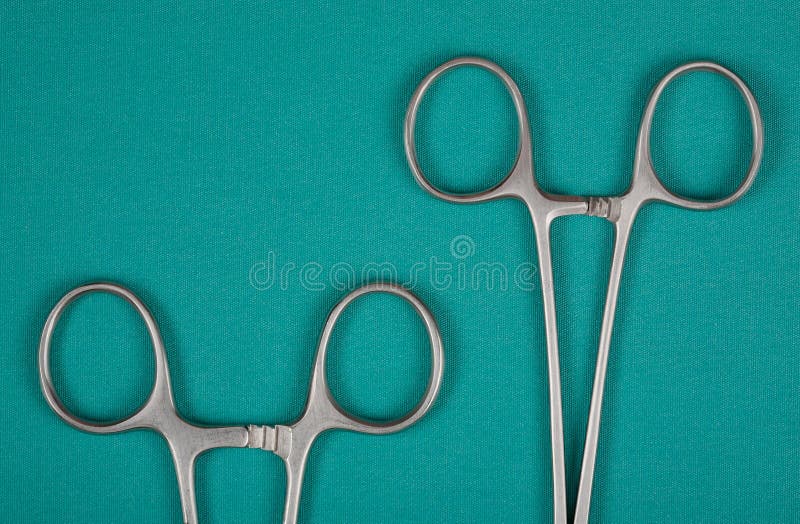 Handles medical clamps on a green background