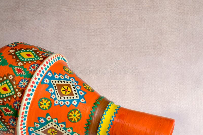 Handmade artistic pained orange pottery vase over grunge texture royalty free stock photo Handmade artistic pained orange pottery vase over grunge texture royalty free stock photo