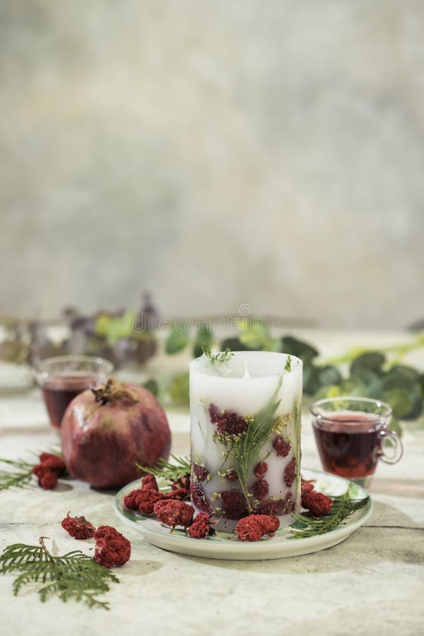 Handmade candles of a unique design, with different flowers, dry