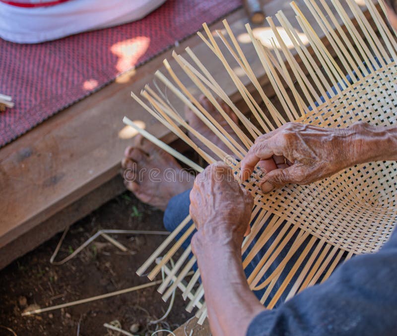 Handmade crafts of craftsman working basketry.