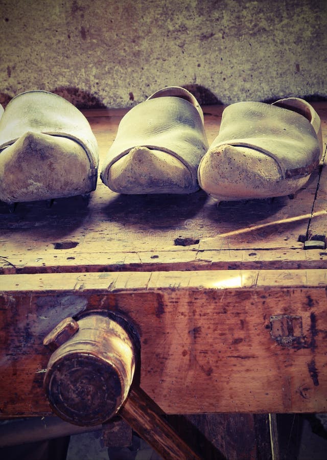 Dutch wooden clogs made by a skilled carpenter in the carpentry stock photos Dutch wooden clogs made by a skilled carpenter in the carpentry stock photos