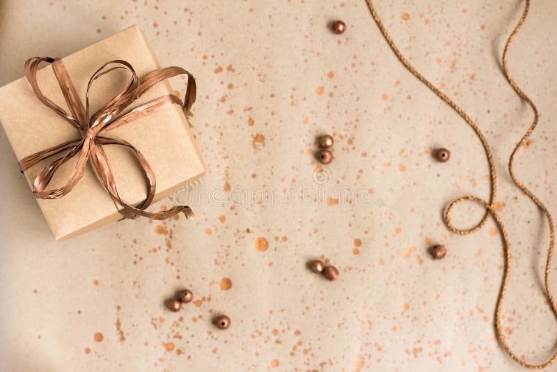 Handmade Gifts Wrapped in Paper Paper with a Bronze Ribbon Stock Photo
