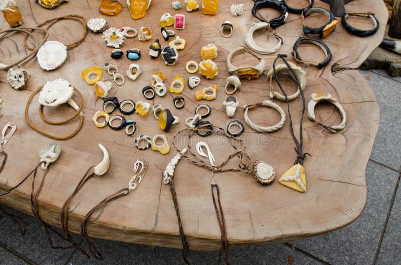 Handmade jewellery bone amber on wooden table