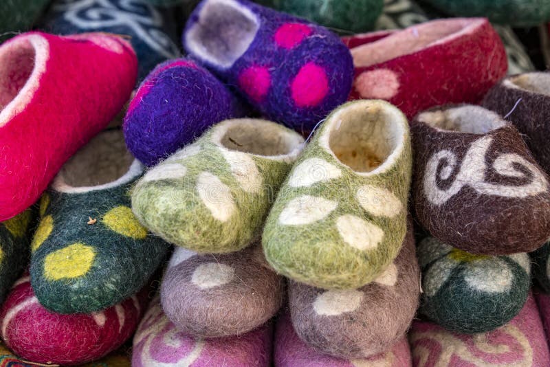 Handmade oriental slippers made of felt with a national ornament. Market. Travel. Kyrgyzstan