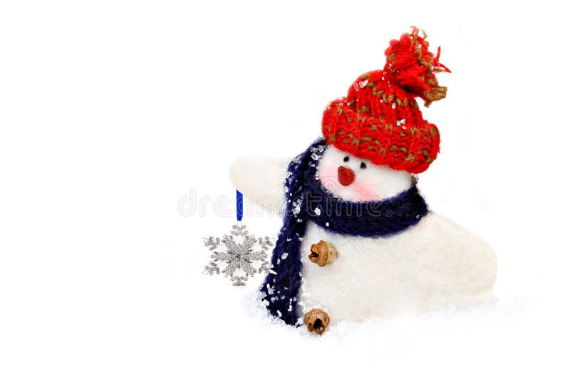 Handmade snowman carrying a snowflake royalty free stock photo Handmade snowman carrying a snowflake royalty free stock photo